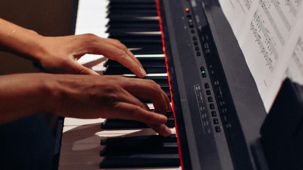 pexels photo 3061984 3061984 Hands elegantly play a modern electric keyboard, delivering captivating music indoors.